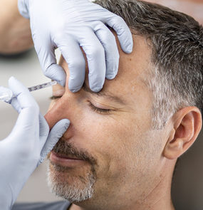 man receiving frown injections at skinbox clinic