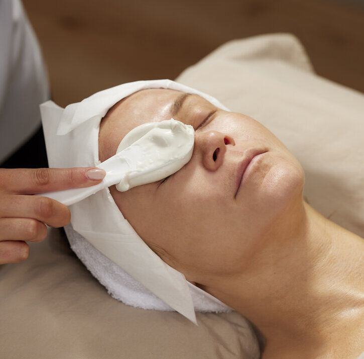 applying Bioalginate mask over a patient's right eye area